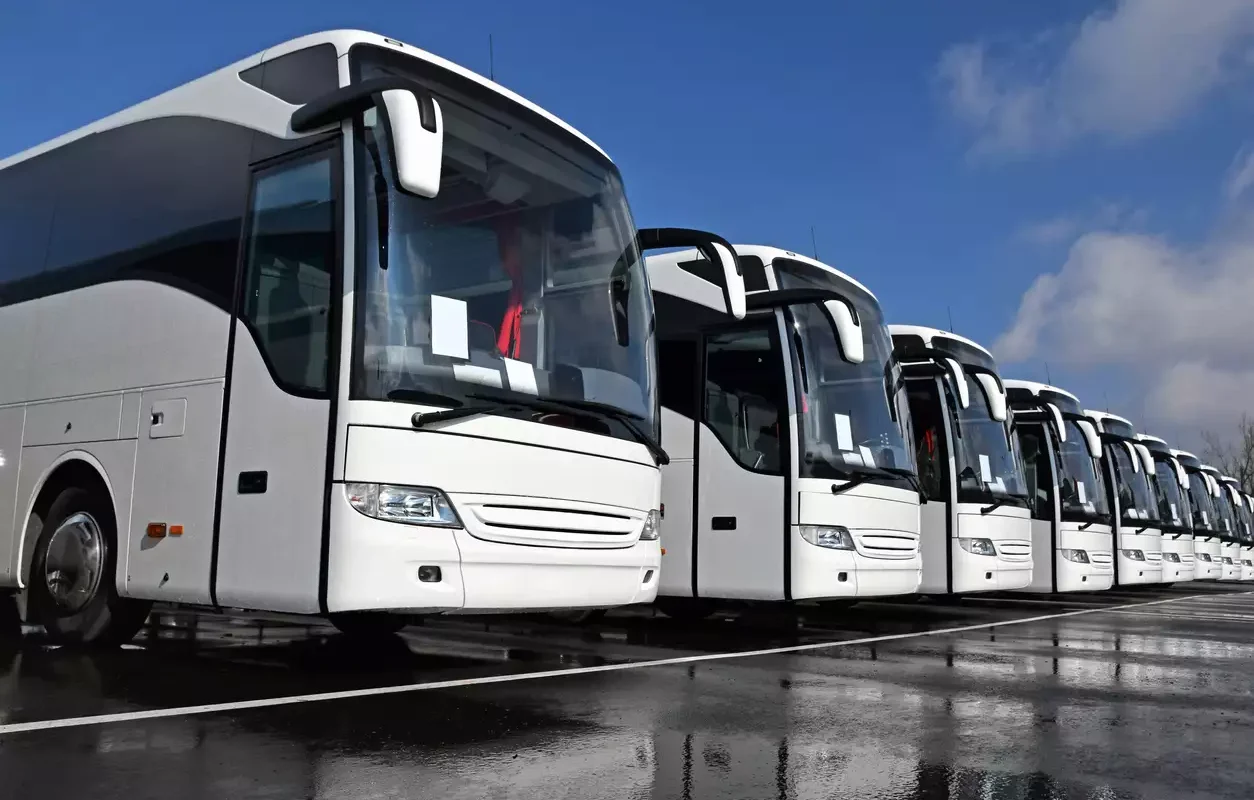 Business travellers arriving by executive car