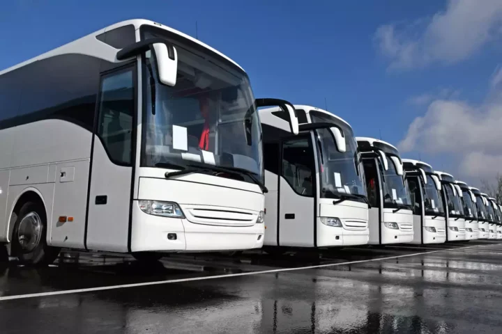 Business travellers arriving by executive car
