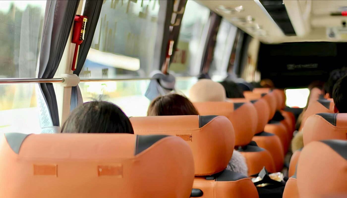 Employees boarding a staff transportation coach